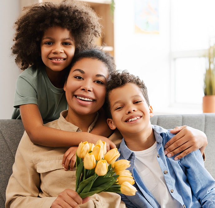 Mother and children on sofa