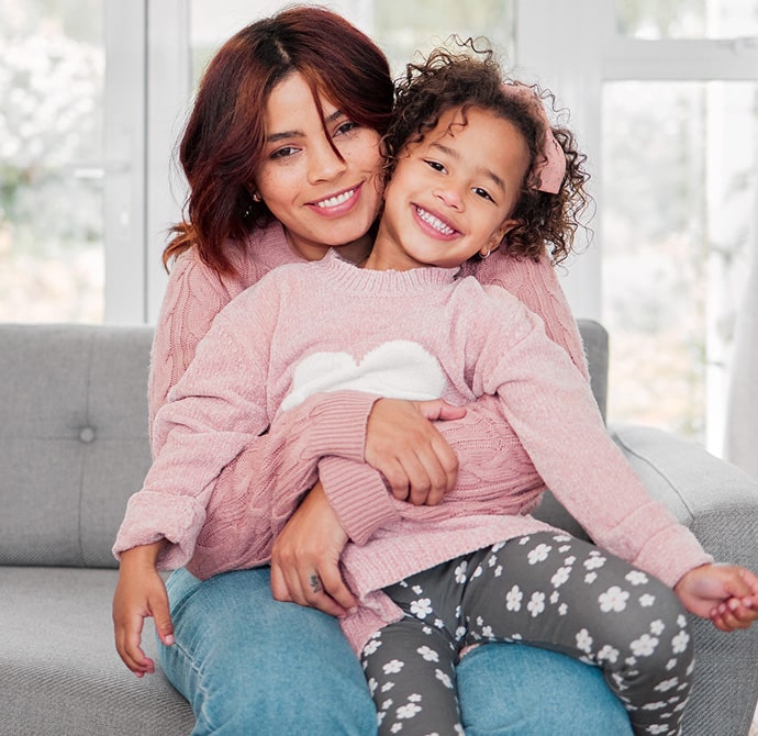 Mother and daughter on new couch